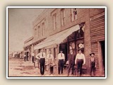 Alex Little's hardware store across the tracks from Depot. (L to R)Caldwell Fidler, Cliff Westmoreland, Bob Readling, Salesman, Alex Little, and Mason Westmoreland.
